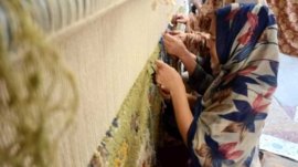 program to teach carpet making to women of Karam district