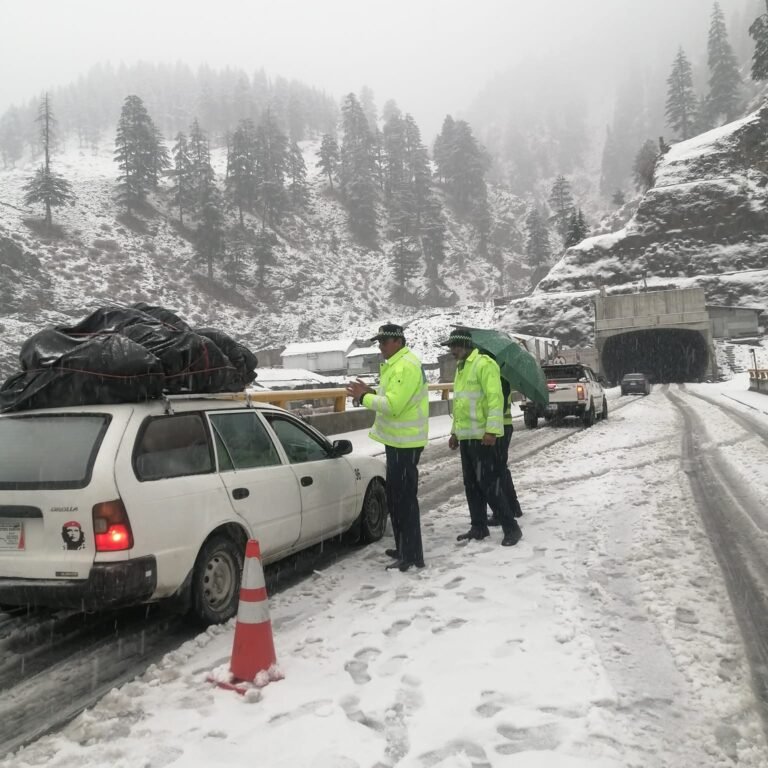 Light snowfall continues on the Lowari Tunnel access road, traffic is flowing