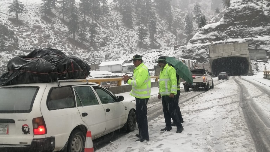 Light snowfall continues on the Lowari Tunnel access road, traffic is flowing