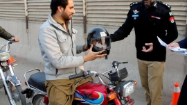 Helmet usage awareness and distribution of free helmets in Peshawar