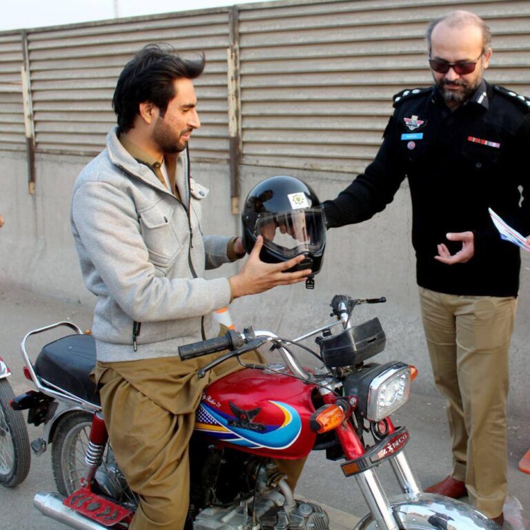 Helmet usage awareness and distribution of free helmets in Peshawar