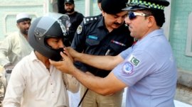 City Traffic Police Peshawar distributed helmets to motorcyclists